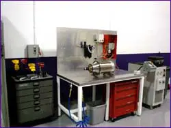 Industrial metalworking machine setup in a workshop.