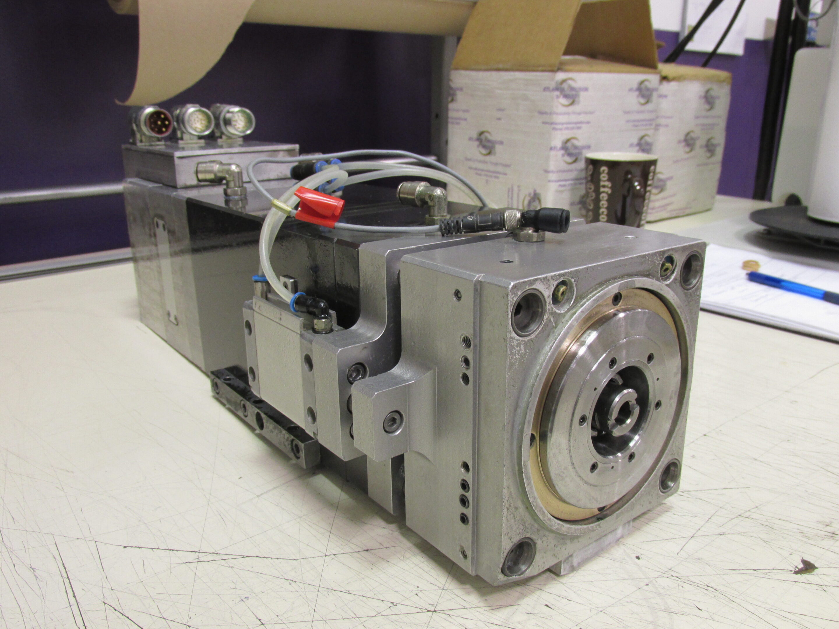 A metallic industrial or scientific device with connectors and wires.