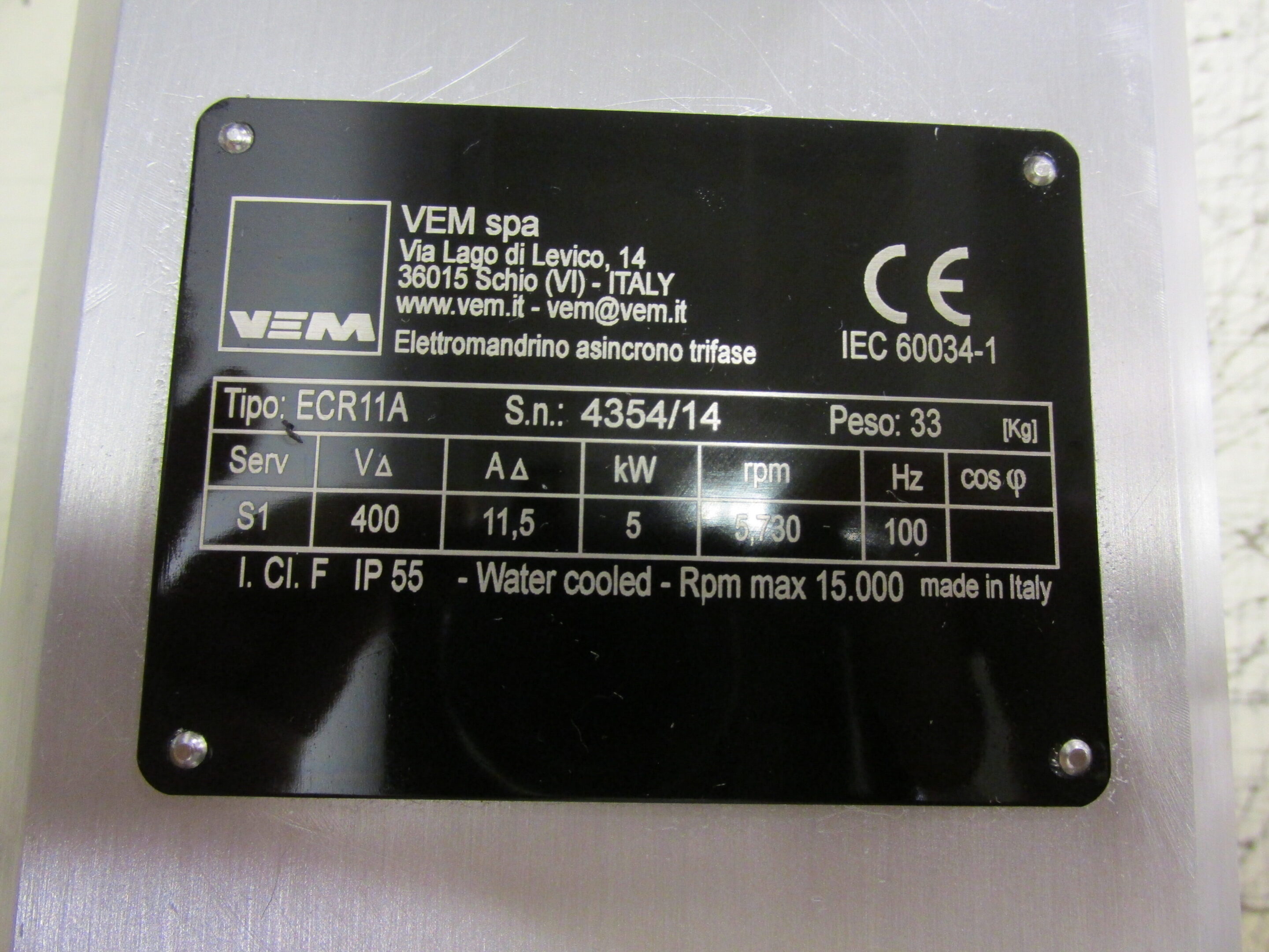 Metal plate with technical specifications and certification marks.
